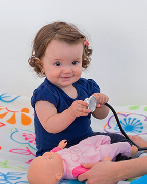 baby holding stethoscope