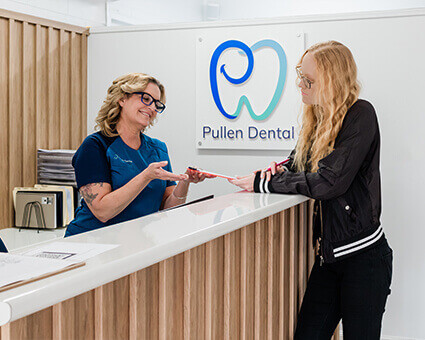 Patient checking in at reception