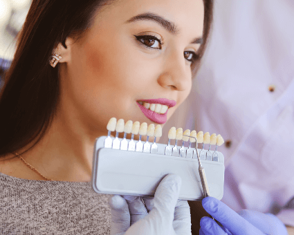 Dental patient fitting veneers width=