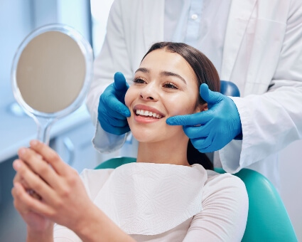 Dental patient looking at mirror