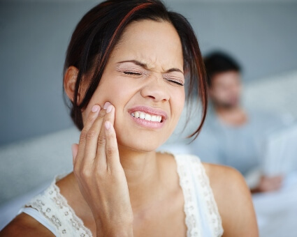 Woman with teeth grinding pain