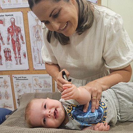 Dr Melinda adjusting baby patient