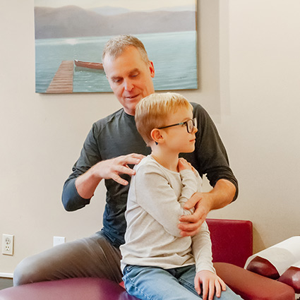 doctor adjusting patients arm