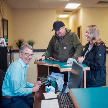 Dr Ludwig laughing with patients