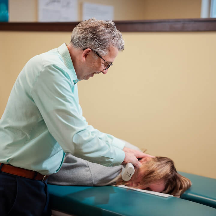 Dr. Ludwig adjusting patient