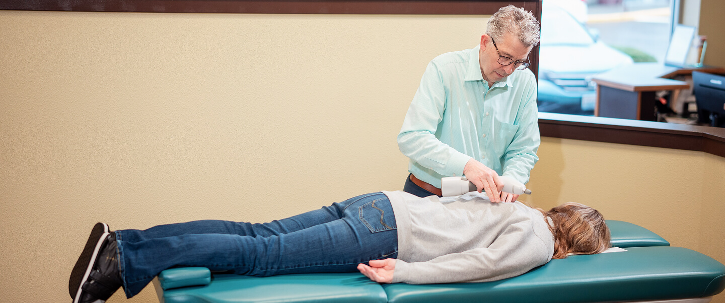 Dr. Ludwig adjusting patient