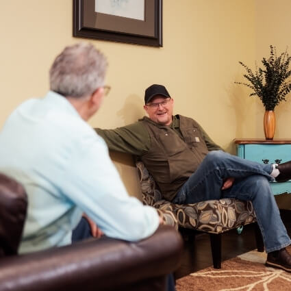 Dr Ludwig talking with man in waiting area