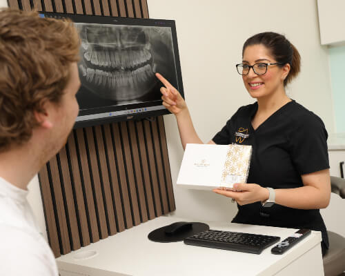 Dr. Nina explaining x-ray to patient