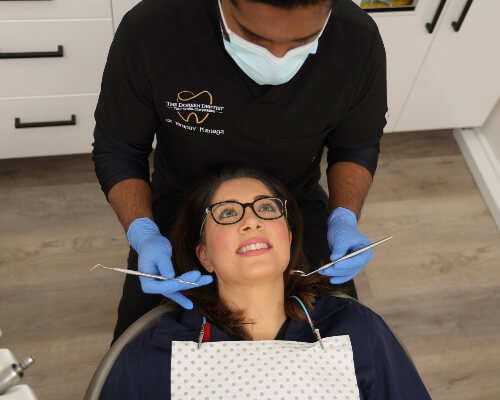 Hawthorn East dentist Dr Branav Kanaga checking patient's teeth