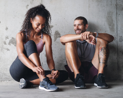 Sporty man and woman getting ready for training