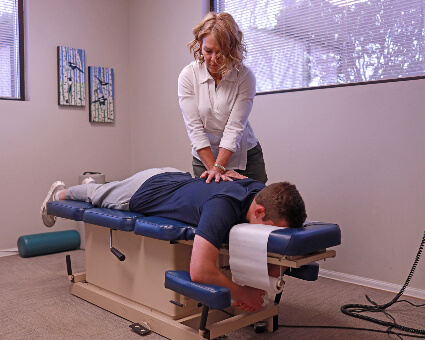Colorado Springs Chiropractor Dr. Lynn adjust man's back