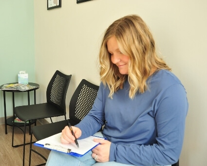 Woman filling in paperwork