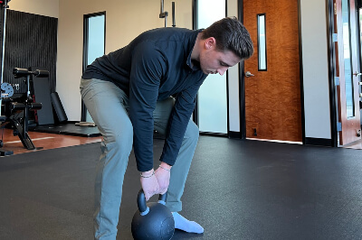 Dr Aleks using kettlebell
