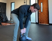 Dr Aleks with kettlebell