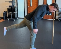 Dr Aleks balancing on one foot