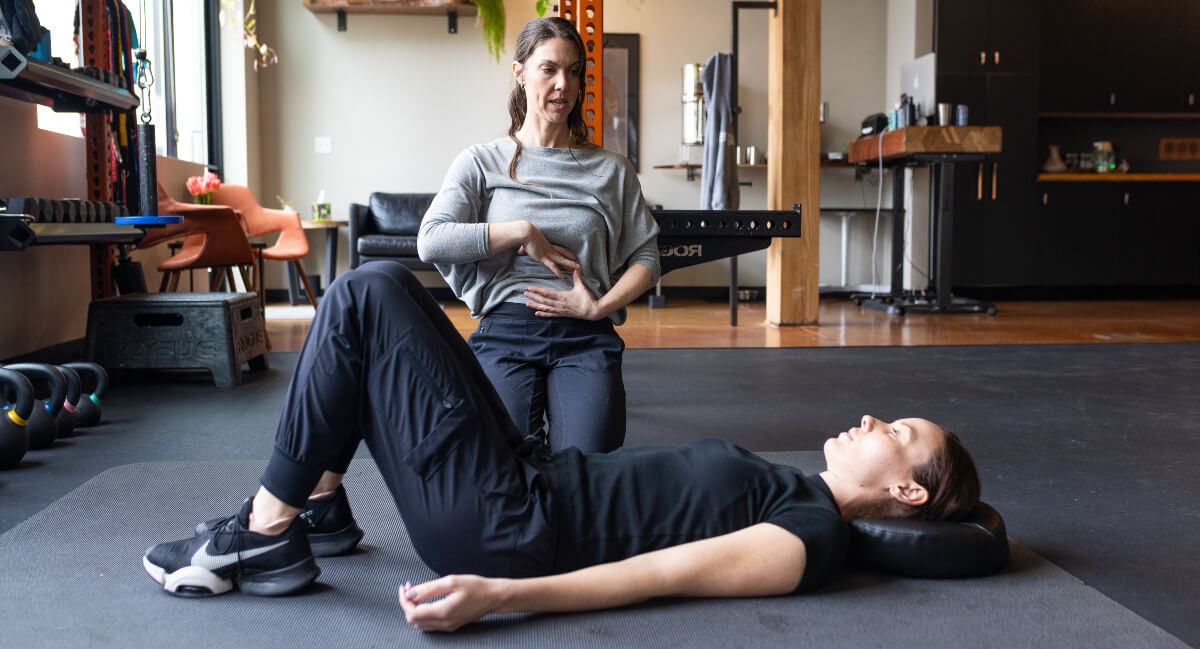 Portland patient learning breathing techniques at Move Better