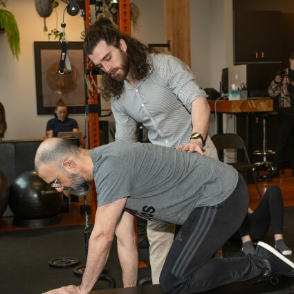 Move Better patient during back workout
