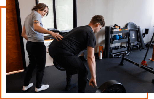 Portland chiropractor Dr. Sophie Kaplan assisting patient with exercises