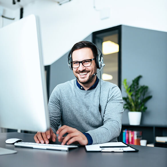 Office worker smiling during a remote meeting
