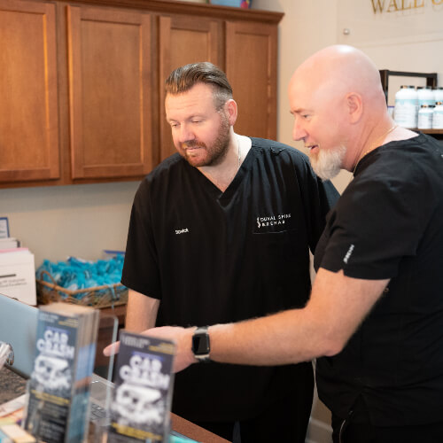 Chiropractor in discussion with patient