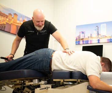 person laying on adjusting table