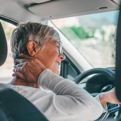 mature-woman-in-car-with-neck-pain-sq