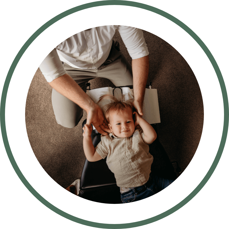 doctor adjusting baby with tool