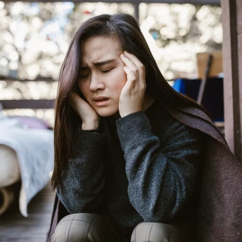 Woman in pain from ear infection
