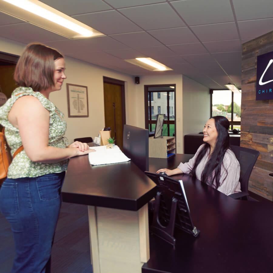patient at reception desk