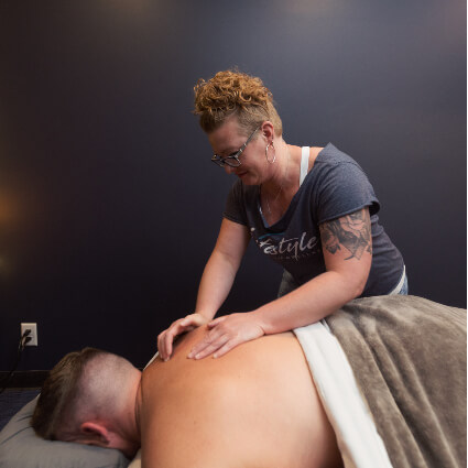 man receiving back massage