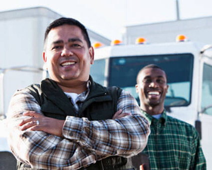 drivers standing by their trucks