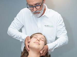 Dr Kevin Adjusting patients neck