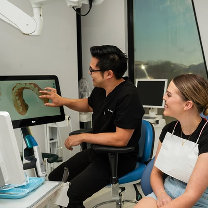 person looking at dental scan with doctor