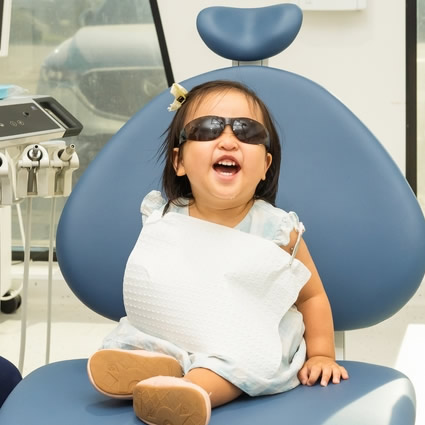 happy-child-on-chair