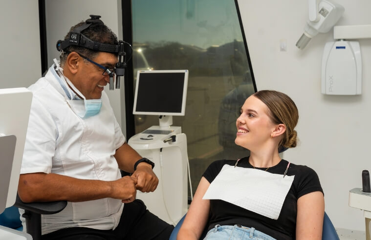 Dentist talking with patient