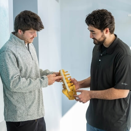 patient and doctor pointing at spine