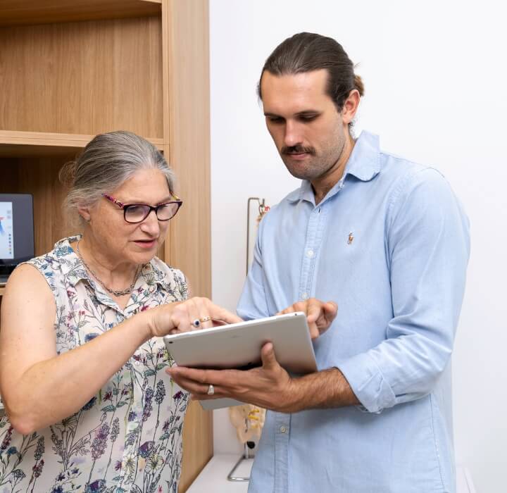 patient pointing at tablet
