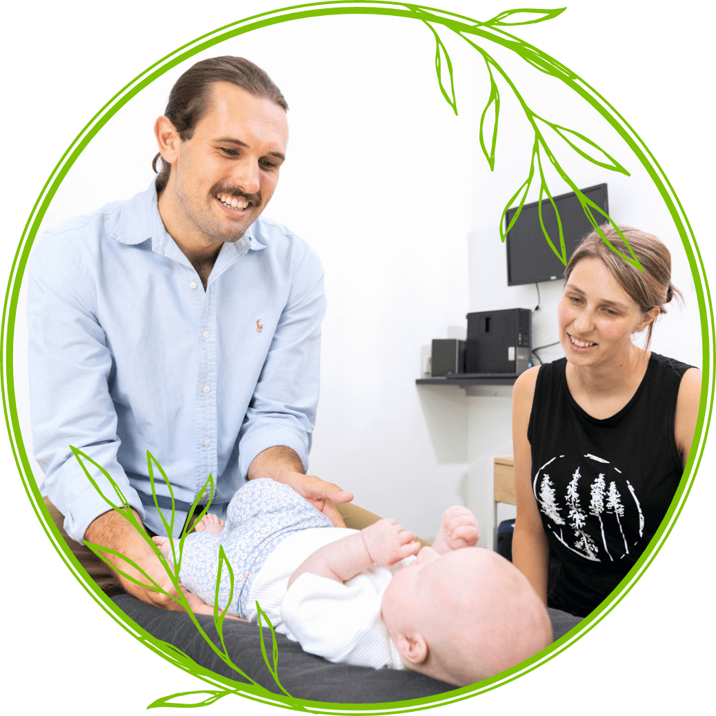 chiropractor smiling at baby