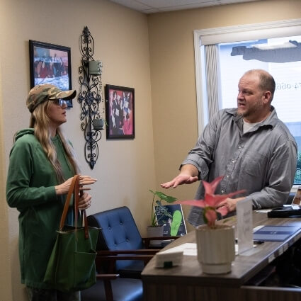 Chiropractor in discussion with patient
