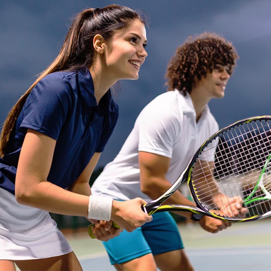 two people playing tennis