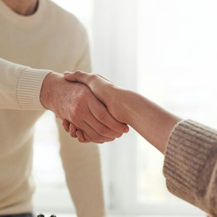 two people shaking hands