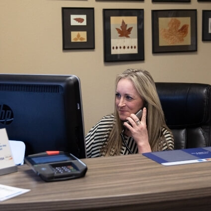 front desk staff on phone