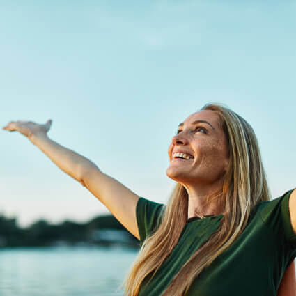 happy woman with arms out