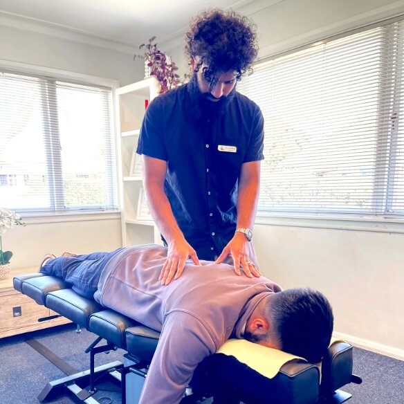 adjusting patient's back