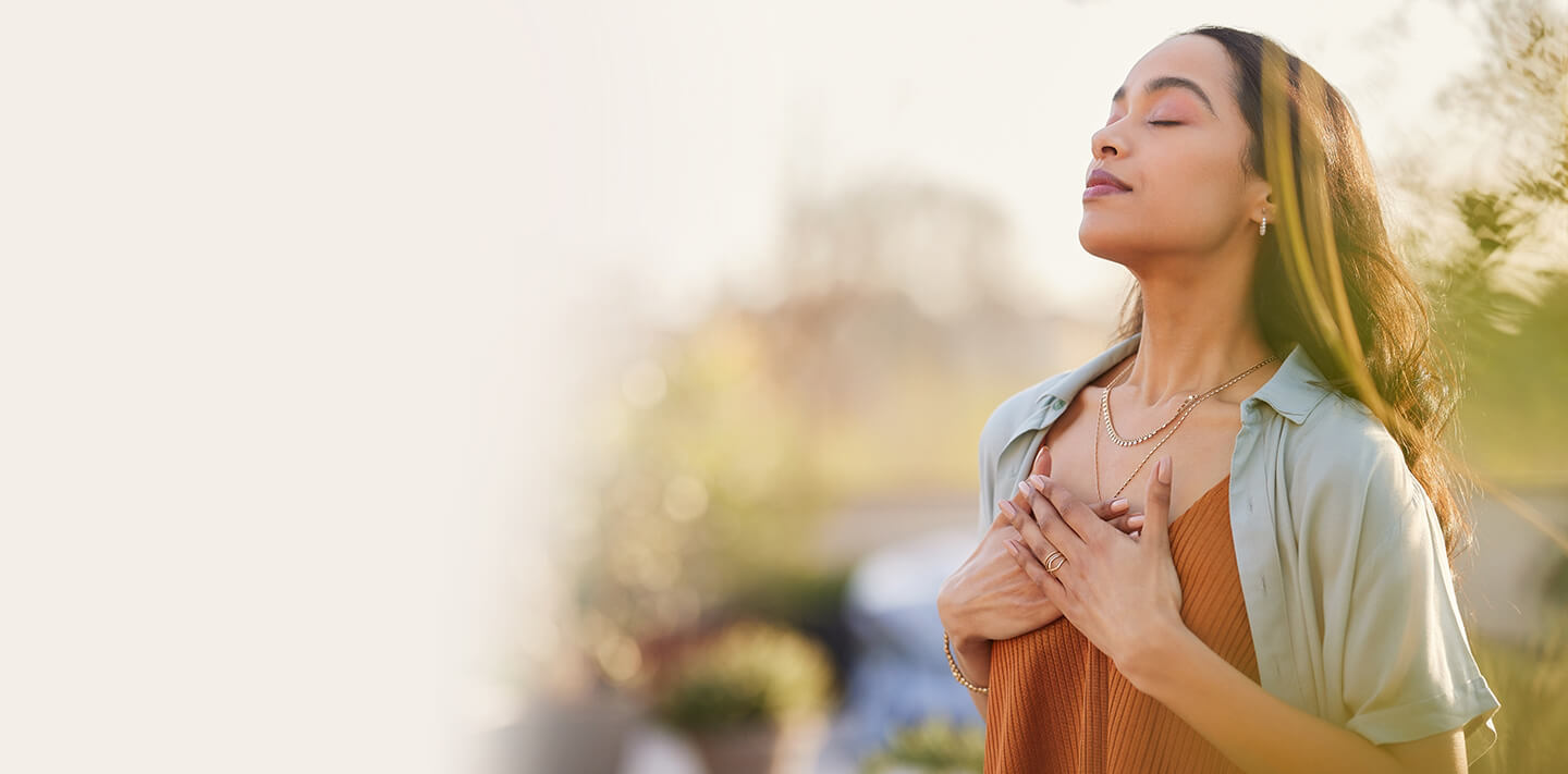 woman with hands on heart