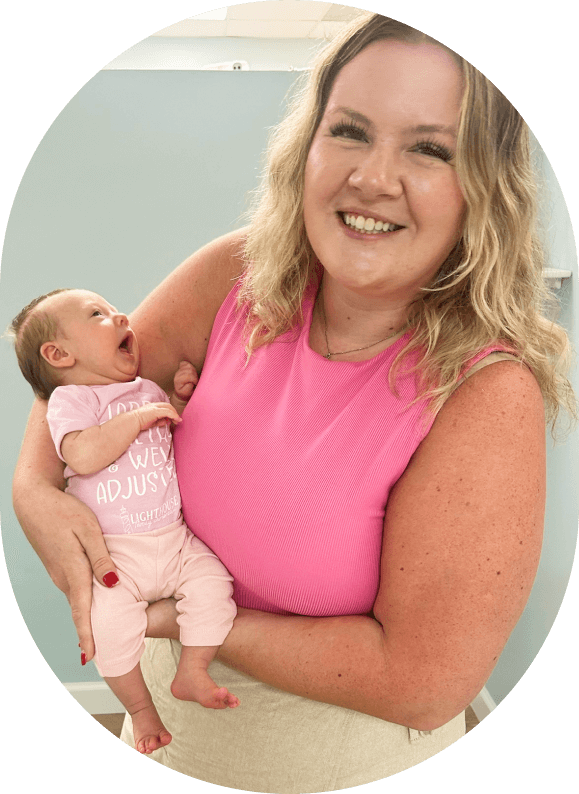 Chiropractor adjusting infant