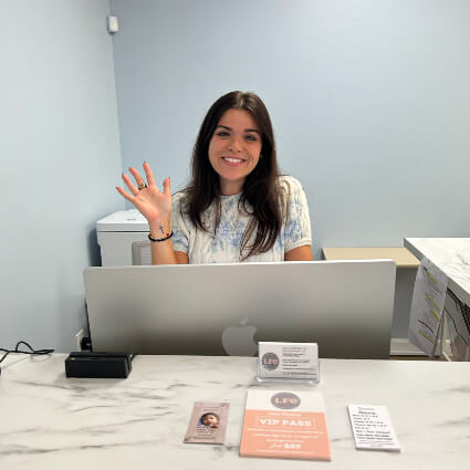 Receptionist waving