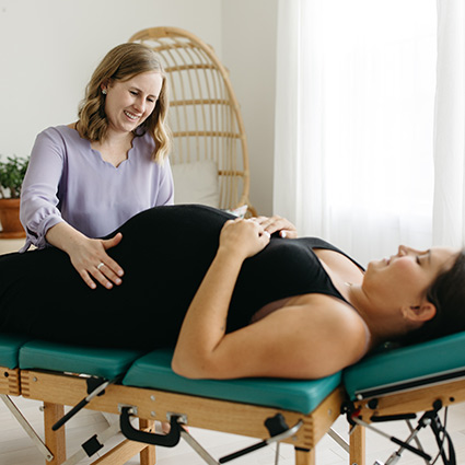 pregnant person being adjusted