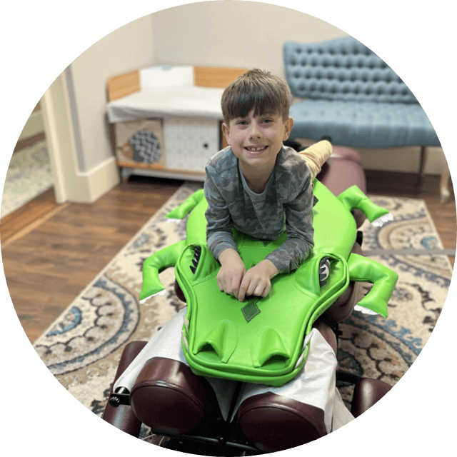 Boy in Child Chiropractor chair