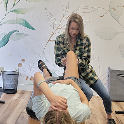 doctor adjusting patients foot